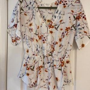 Sienna Sky button front elastic waist peplum top